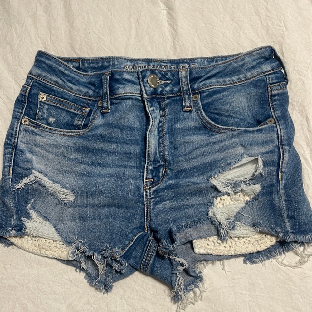 American Eagle “high rise shortie” “next level stretch” denim shorts Sz 8.